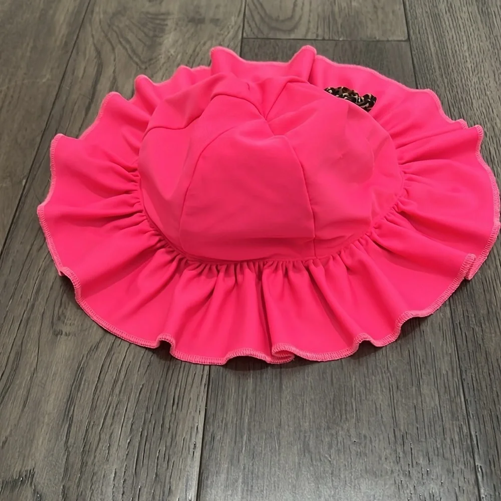 Baby swim hat with leopard like flowers and ruffle trim